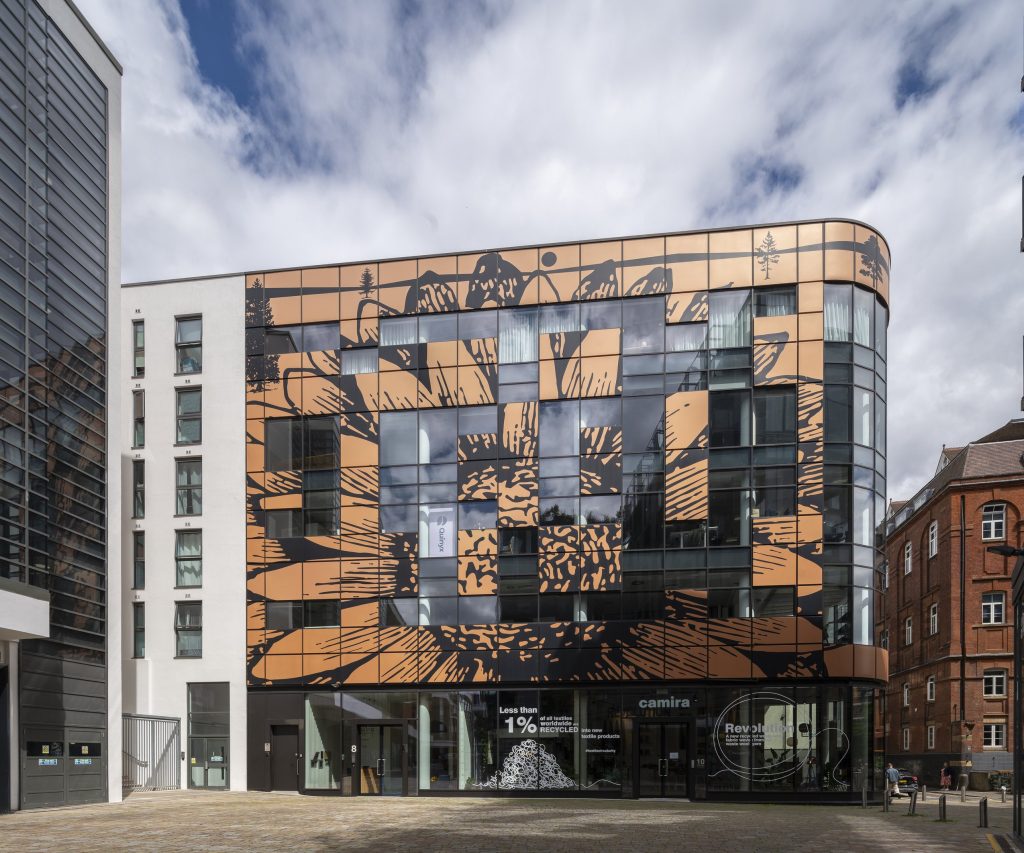 Newly refurbished office space in The Poppy Building, located in Brewhouse Yard, London's Tech Hub, featuring floor-to-ceiling windows and a communal roof terrace.