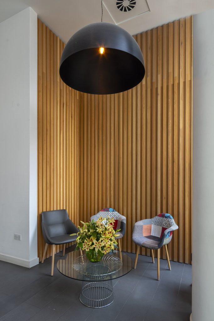 Newly refurbished office space in The Poppy Building, located in Brewhouse Yard, London's Tech Hub, featuring floor-to-ceiling windows and a communal roof terrace.